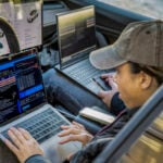 Studenter vid KTH i Tesla Model 3, vars dataportar är bättre skyddade än de andra bilarna som testats.