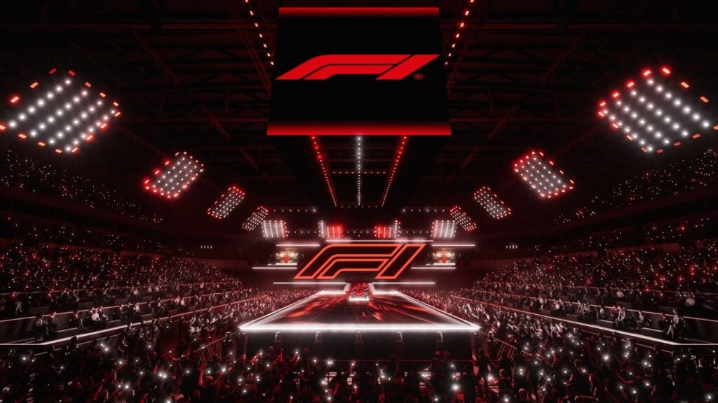 En visualisering av F1 75 Live-eventet i O2 Arena, med Formel 1-logotypen på en upplyst scen och en stor publik i en arena fylld av röda och vita ljus.