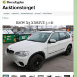 Annons från Kronofogden med vit BMW X5.